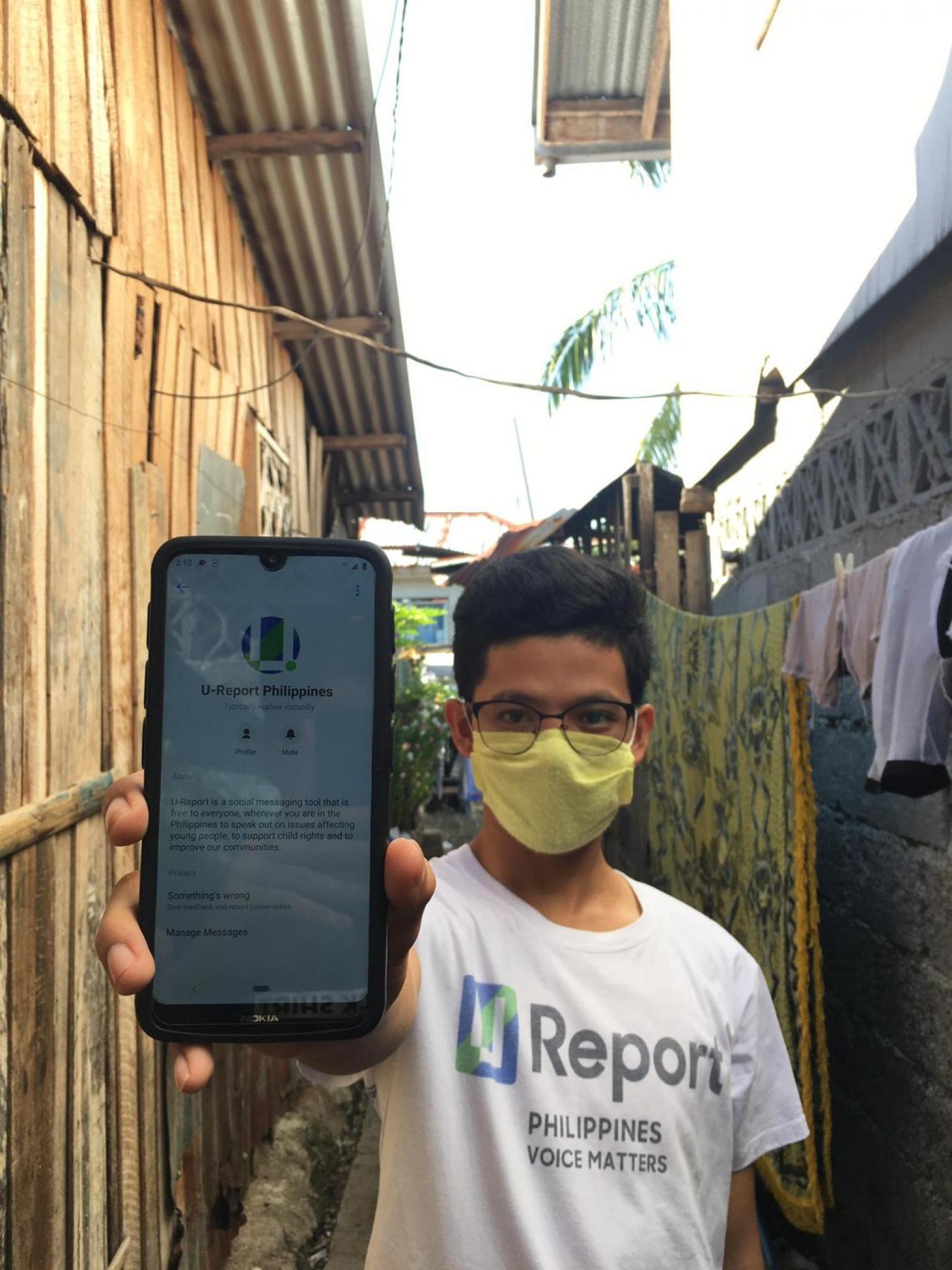 Abdul Rauf Lumabao, 20, answers survey questions from the U-Report platform