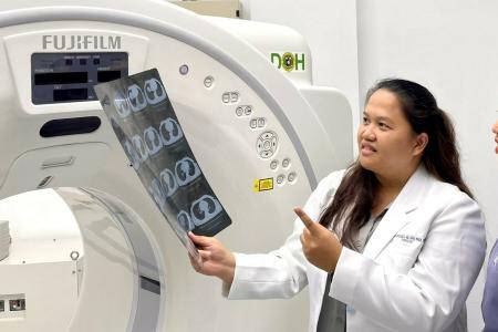 Female doctor explaining CT scan result to patient