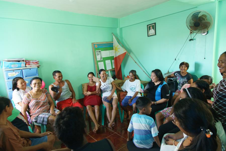 WFP's Joan Odena meets with community members