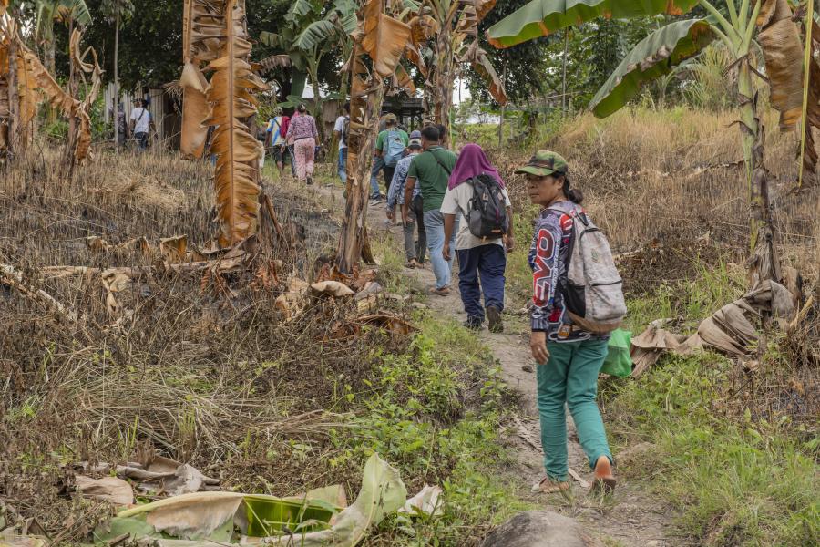 Lacking modes of transportation, the Teduray walks for two hours in uneven terrain to reach their farms. 