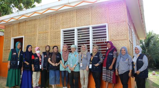 Community facilitators pose in front of the Women-Friendly Space (WFS) in Guindulungan, Maguindanao del Sur.