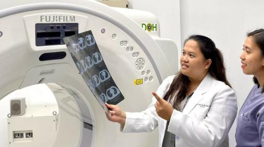 Female doctor explaining CT scan result to patient